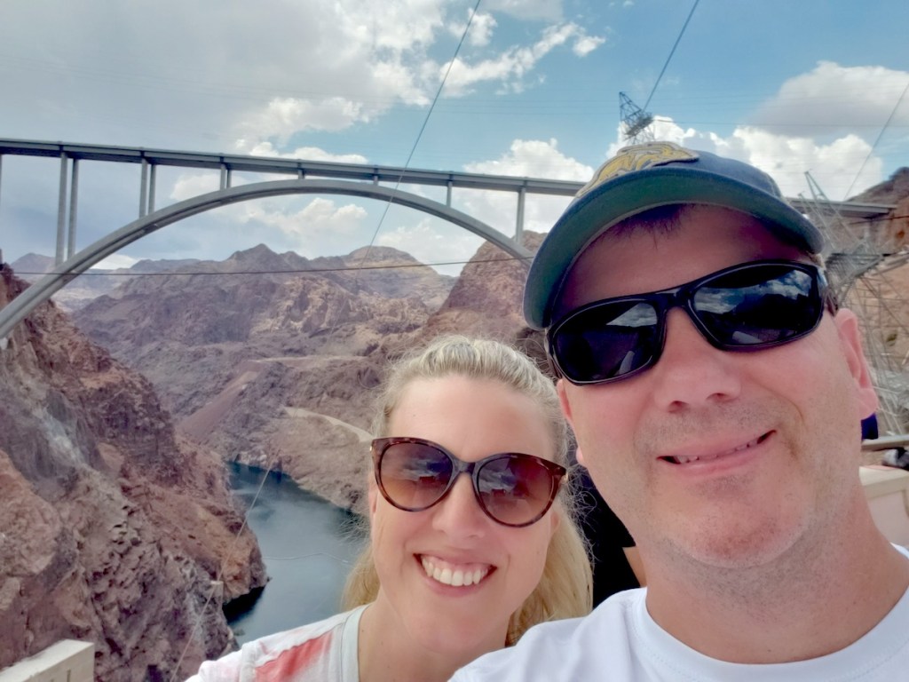 man and woman taking selfie at hoover dam