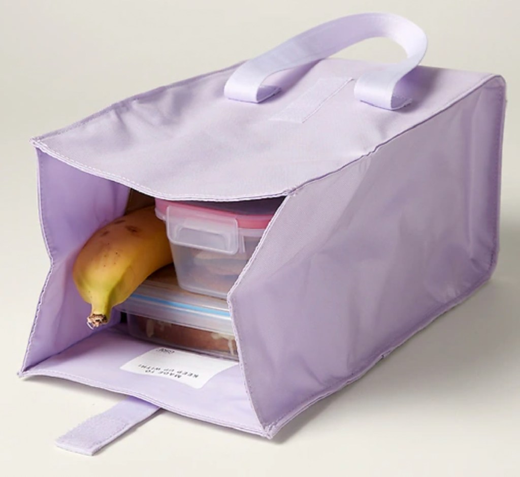 lavender lunch bag with banana and containers in it