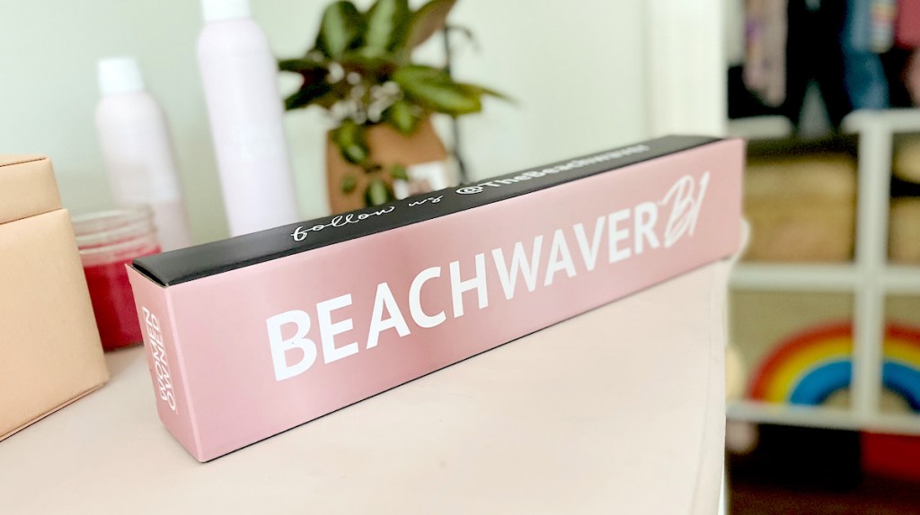 beachwaver curling iron box sitting on pink dresser