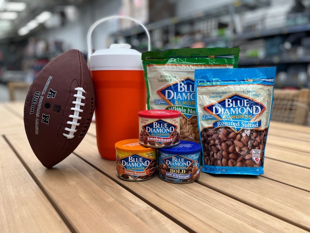 Blue Diamond Almonds with a football and an insulated cooler