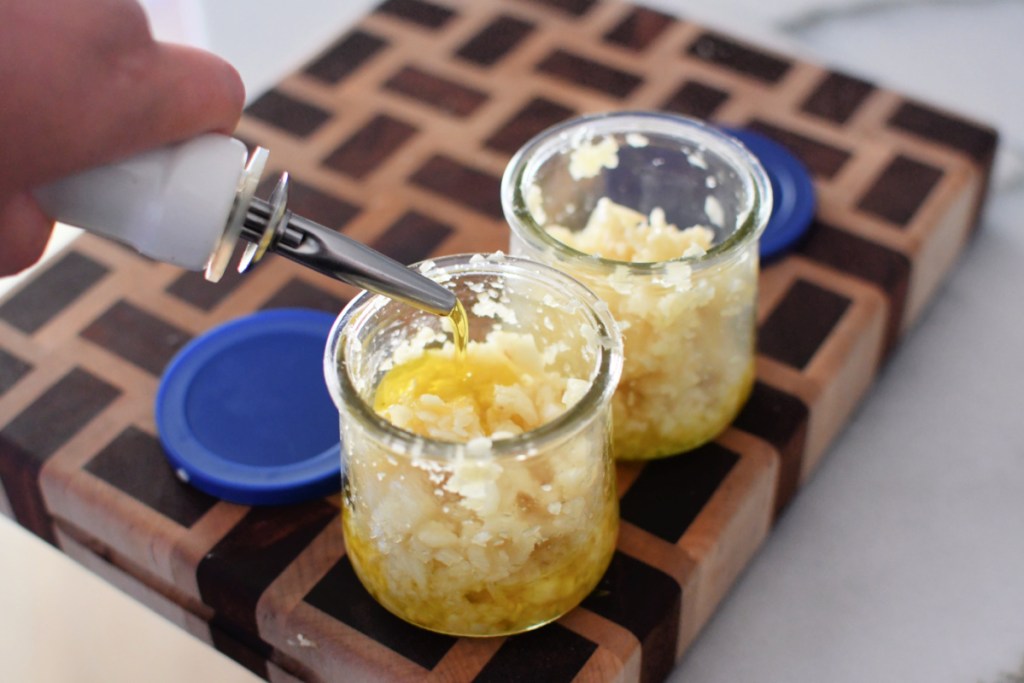 jars of minced garlic and olive oil - garlic hack 