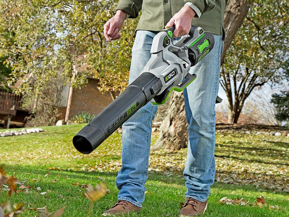 person using leaf blower