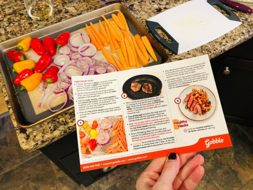 Gobble recipe card in front of cooking sheet filled with veggies