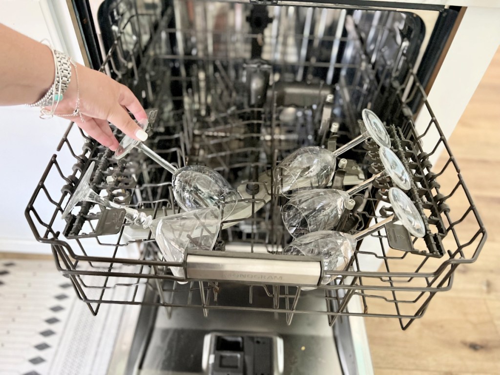 loading wine glasses in a dishwasher