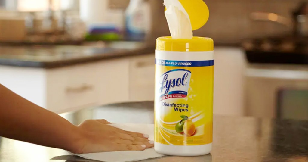 women cleaning kitchen with lysol disinfecting wipes