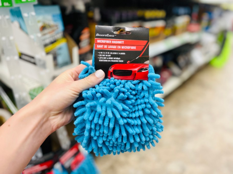 hand holding a blue microfiber mitt, one of our favorite camping hacks to try in 2024
