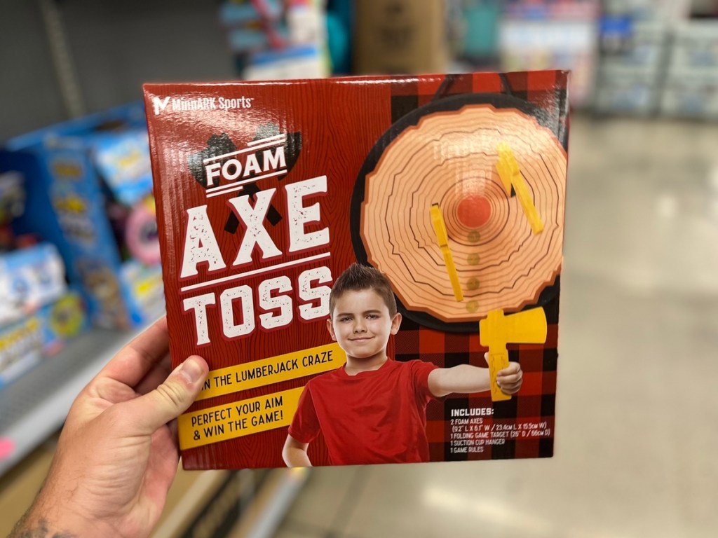 holding a boxed axe toss game