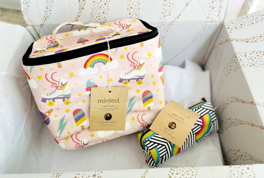 close up of minted lunchbox and pencil case in delivery box