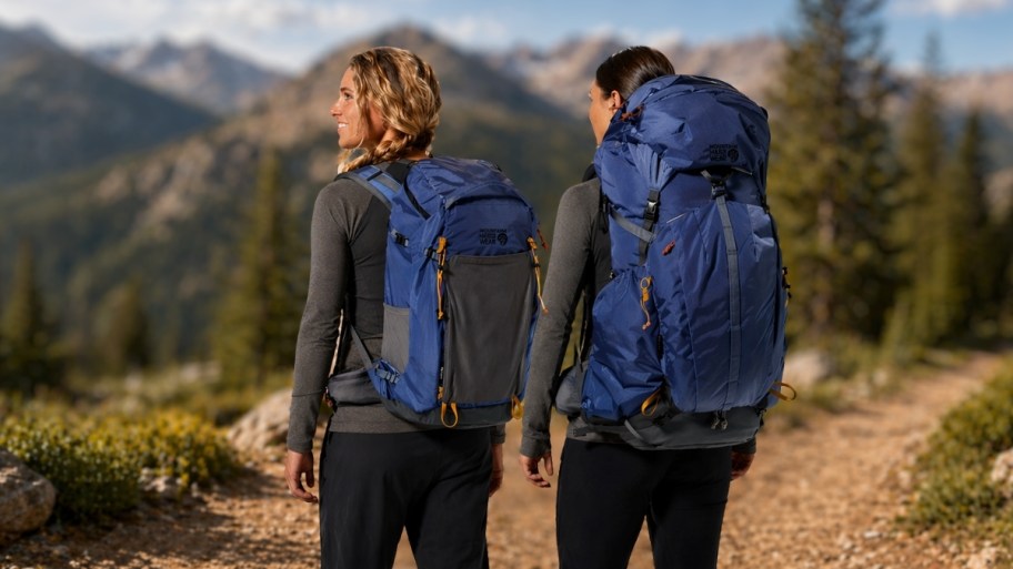 two women with backpacks hiking