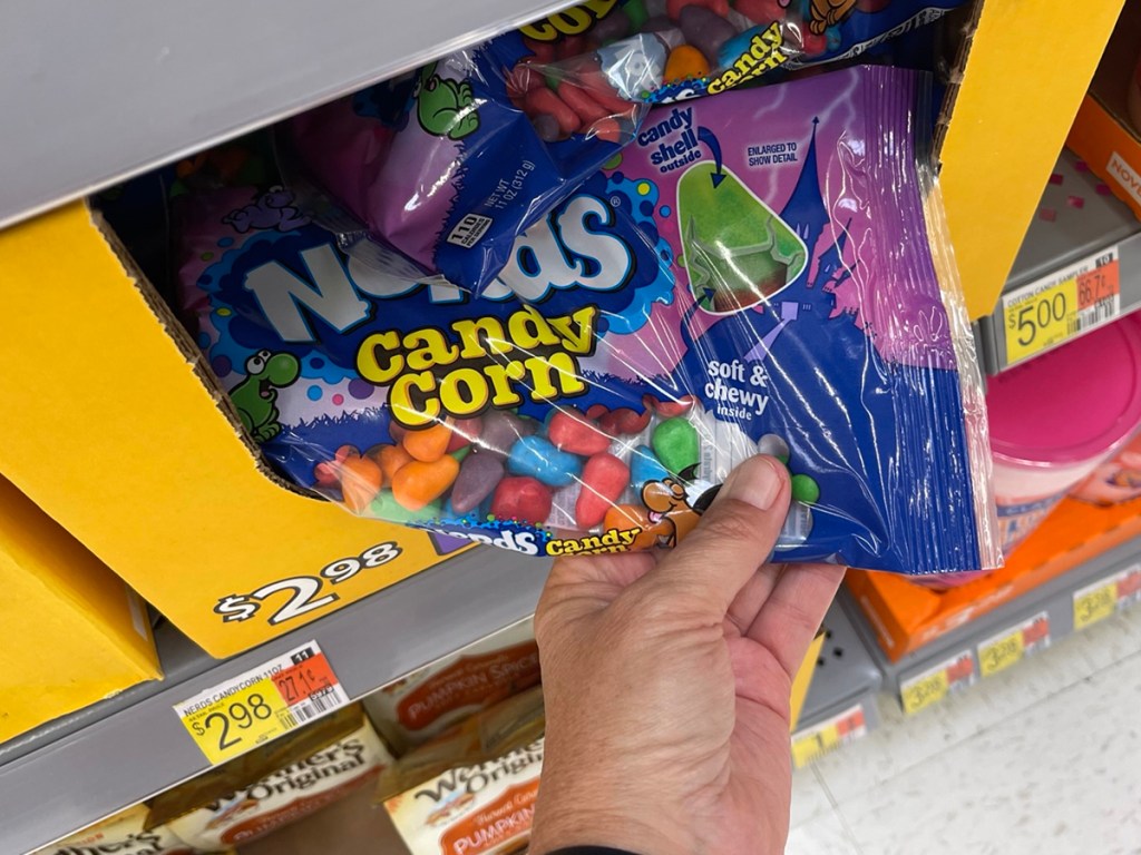 hand holding nerds candy corn 