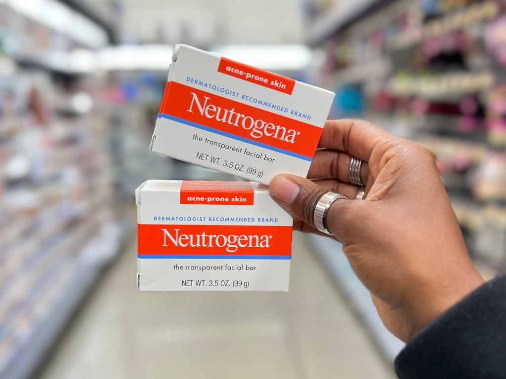 hand holding two neutrogena facial bars