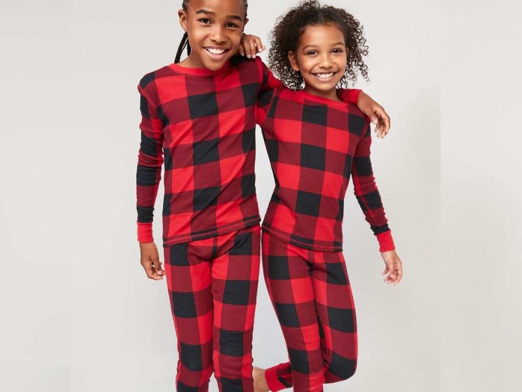 kids wearing matching holiday pajamas