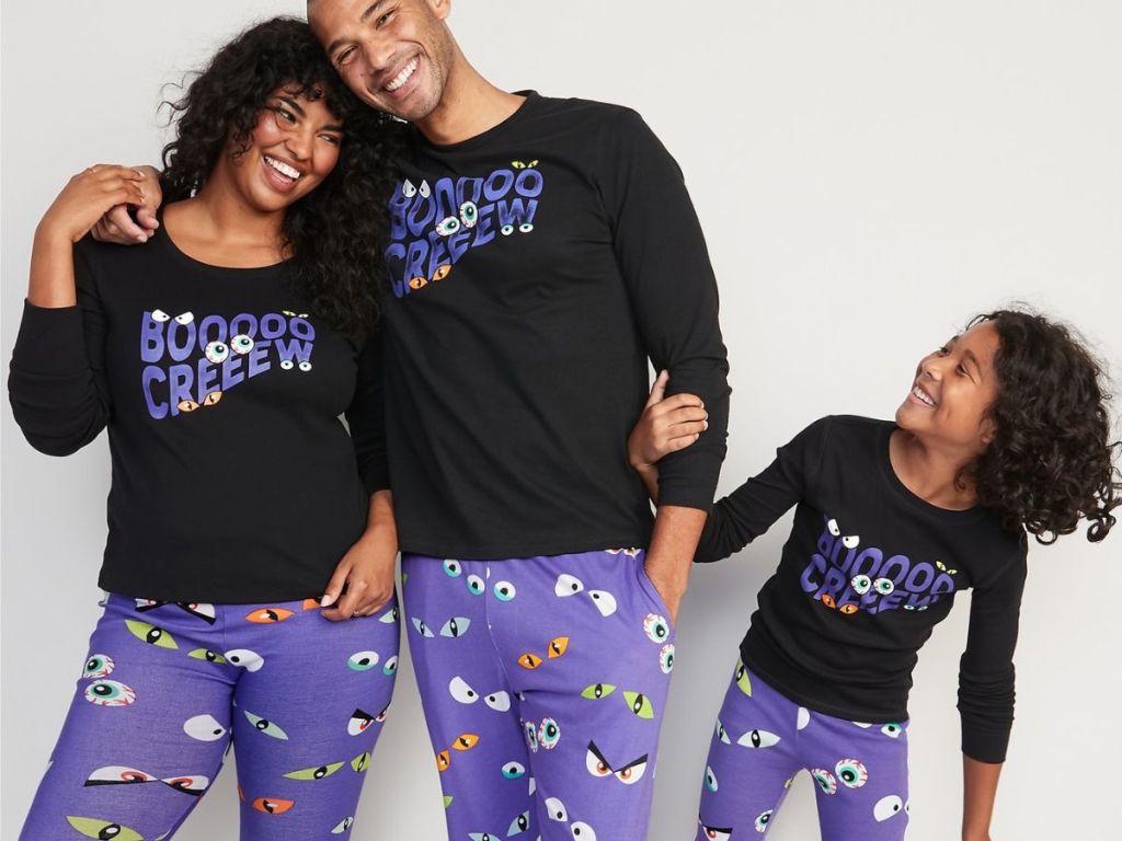 family wearing matching halloween pajamas