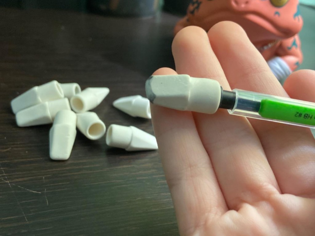 white eraser on a green pencil