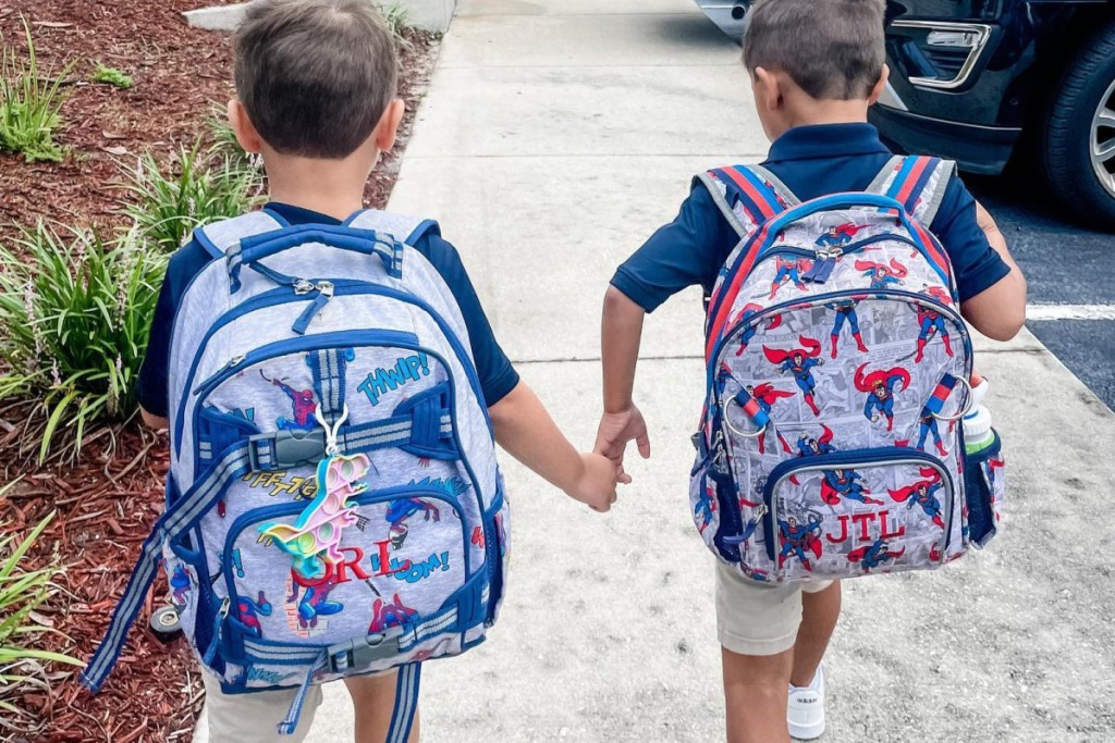 2 boys with spiderman backpacks