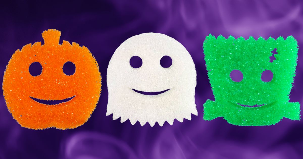 3 scrub daddy halloween sponges in pumpkin, ghost and frankenstien monster shapes on a purple background