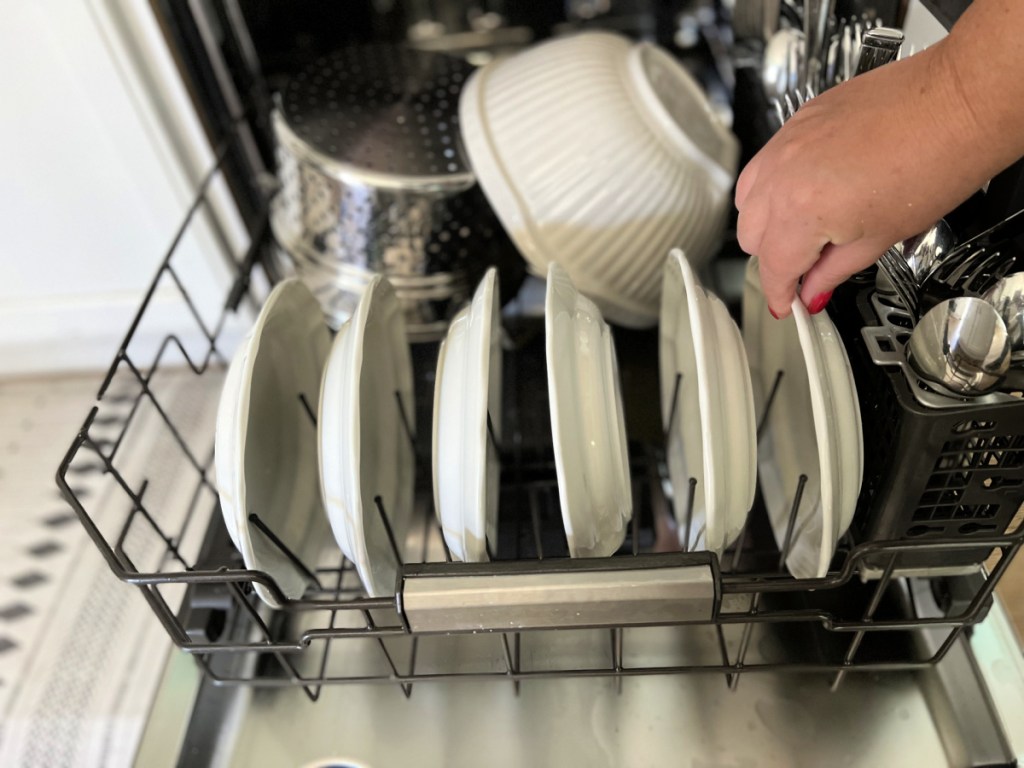 stack dishes facing towards the center of the dishwasher