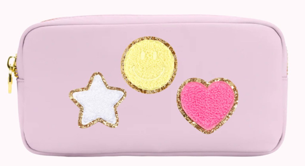 pink pouch with white star yellow smiley and pink heart patches