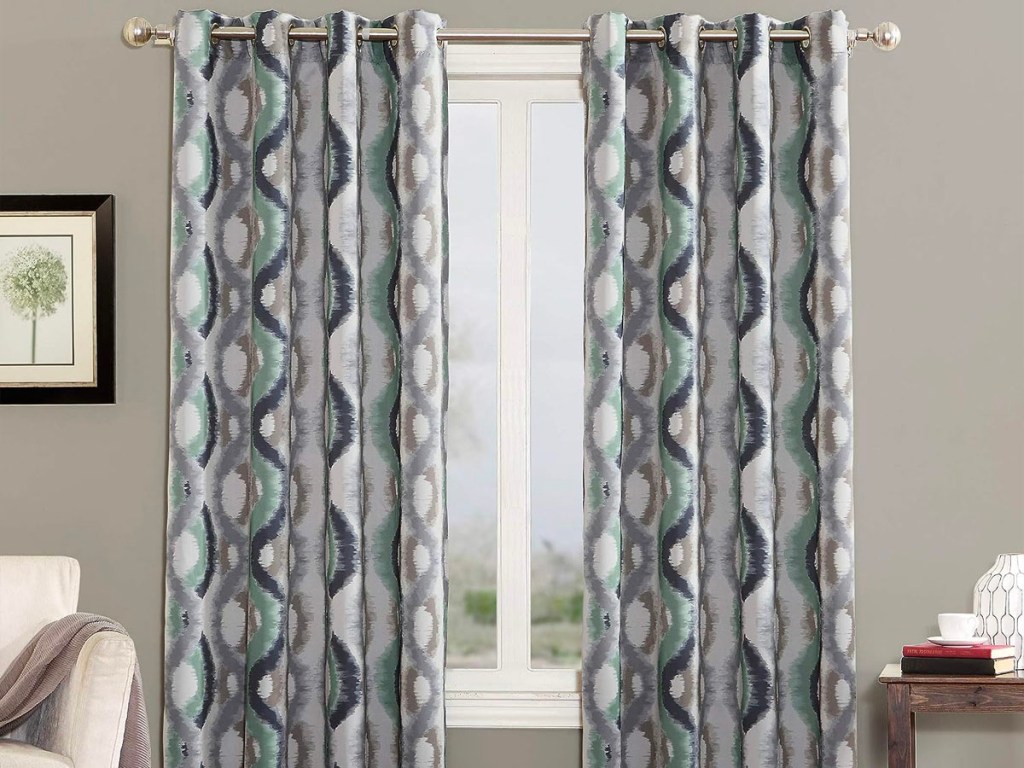 white and blue curtains hanging at window