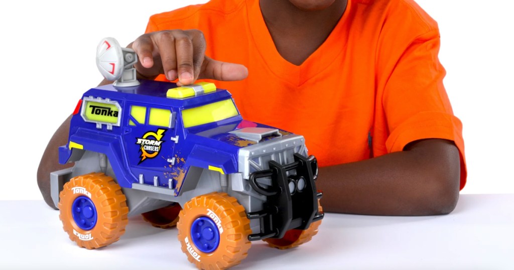 boy holding toy truck