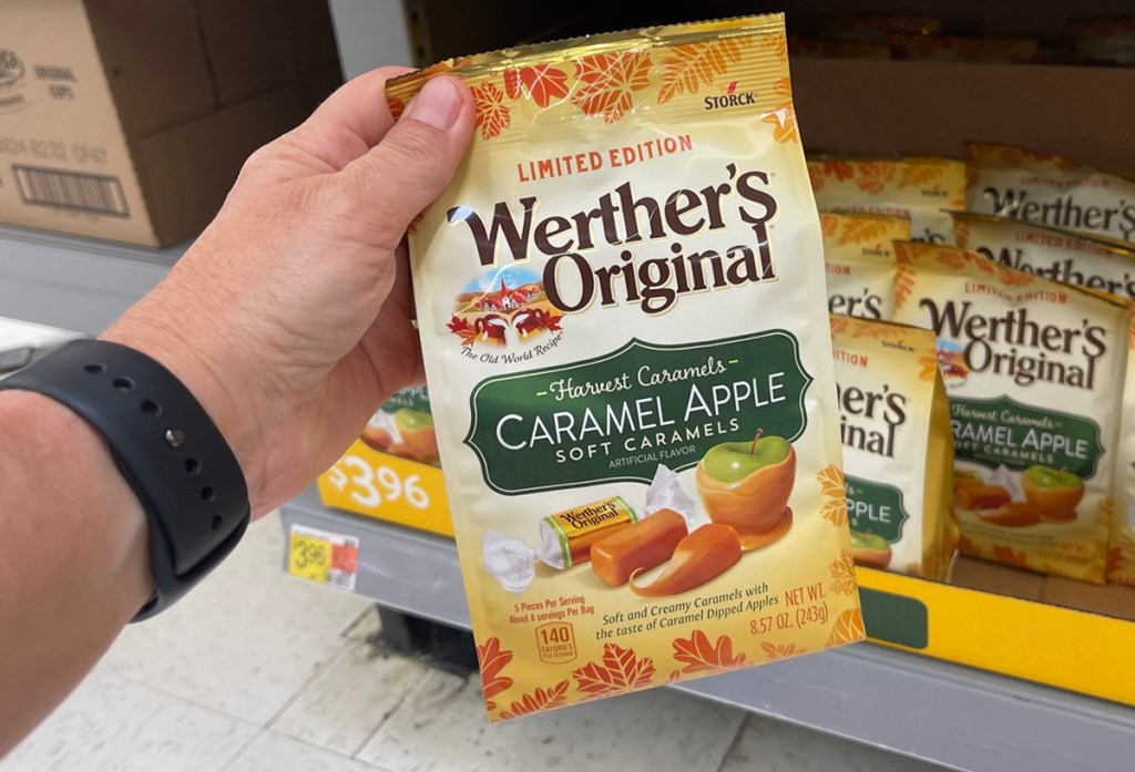 hand holding werther's original caramel apple candy