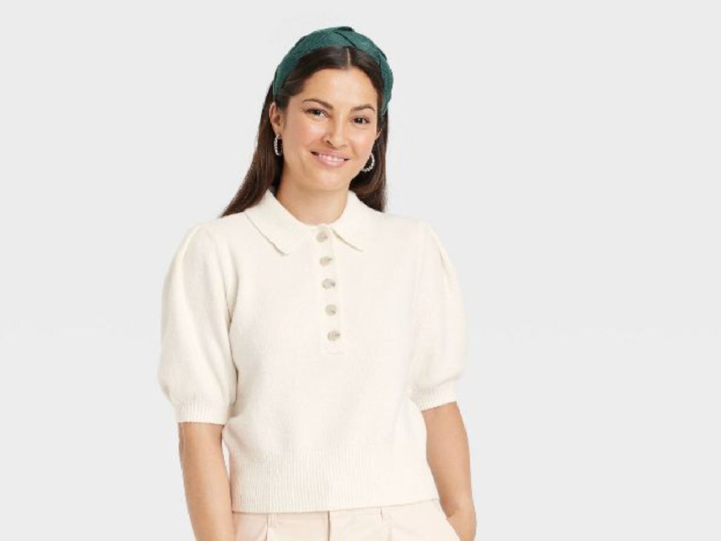 woman in cream sweater