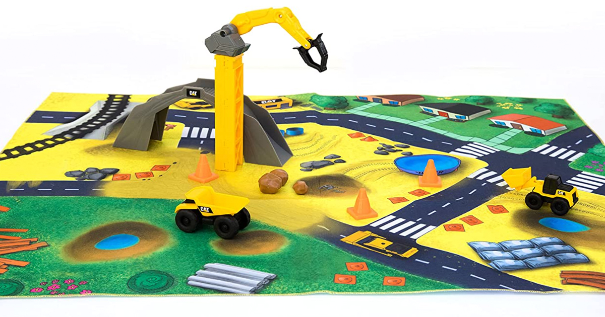 stock image of a cat little machines construction mat and truck