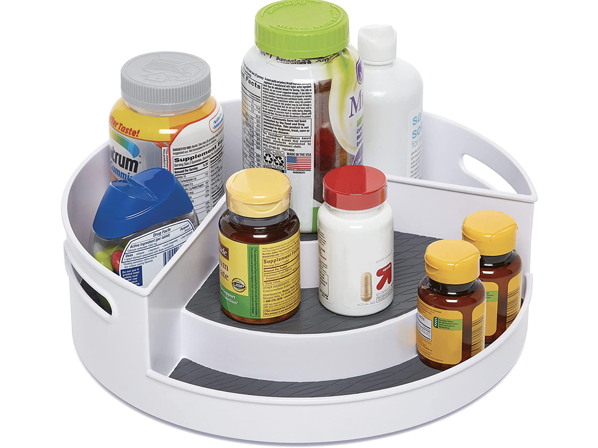 stock image of a Multi tier lazy susan turntable filled with medicine