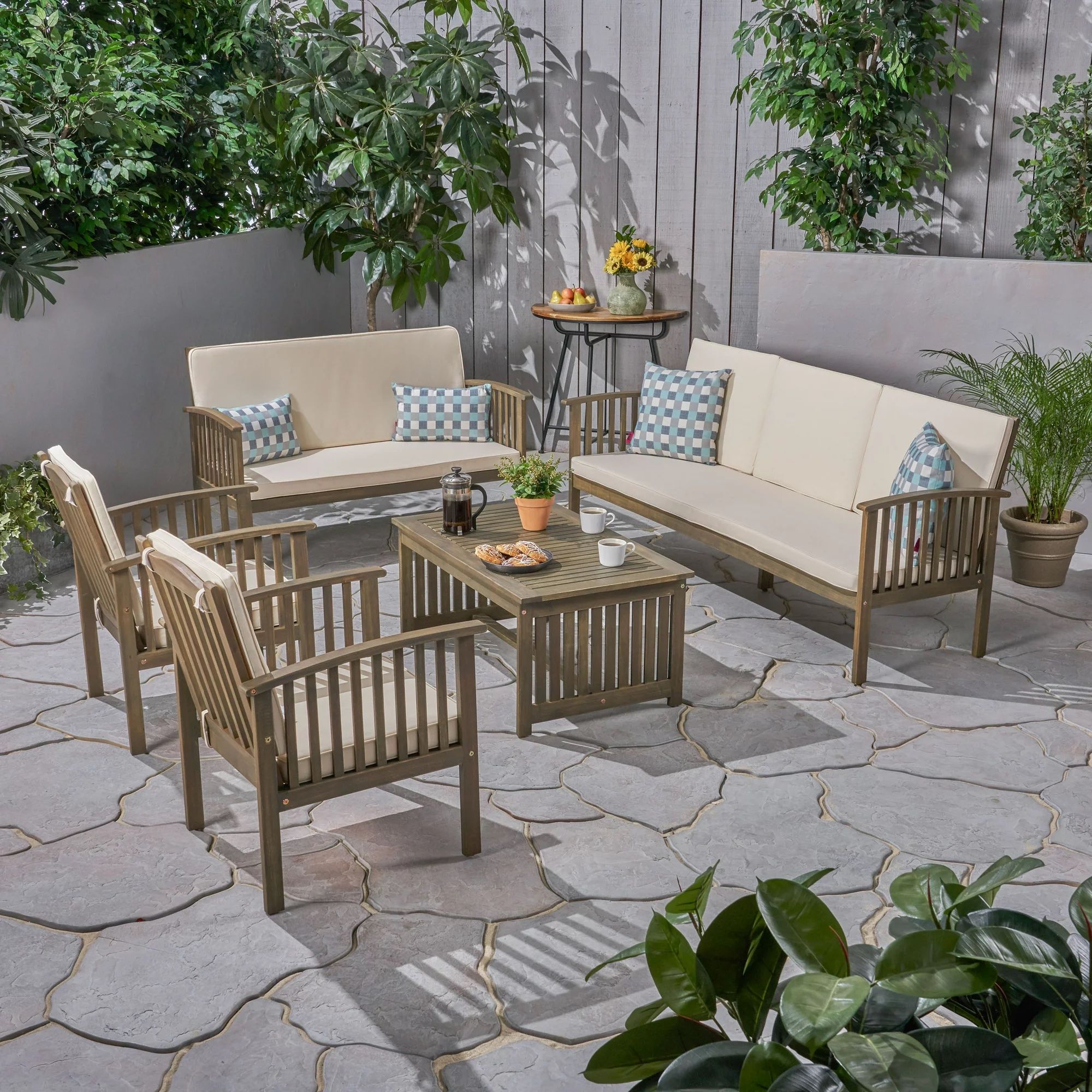 brown patio set with 2 couches 2 chairs and table