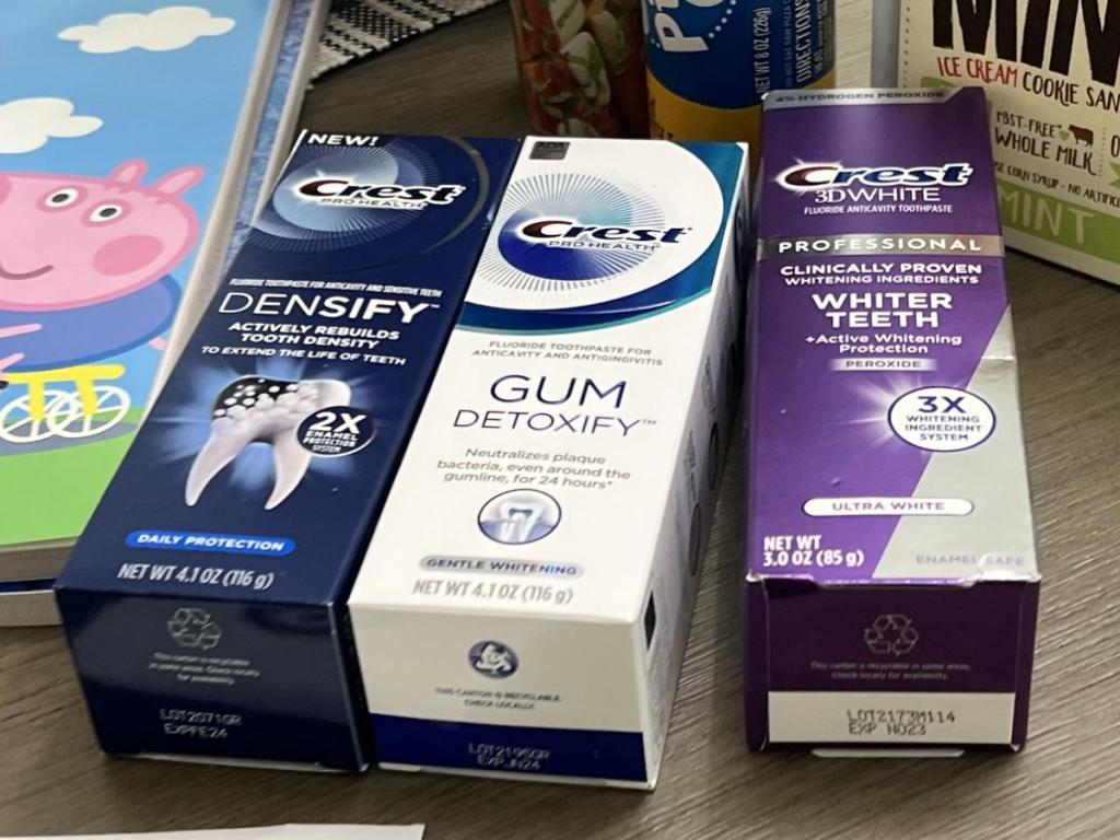 three boxes of crest adult toothpaste