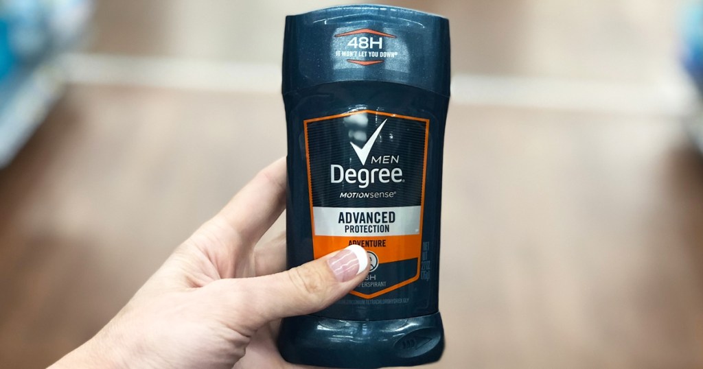 hand holding up a stick of degree men's deodorant