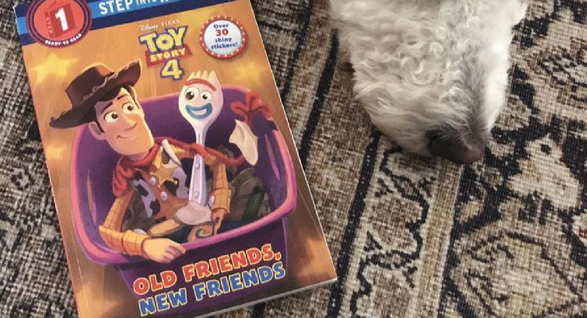 Disney_Pixar Toy Story 4 book next to a dogs snout