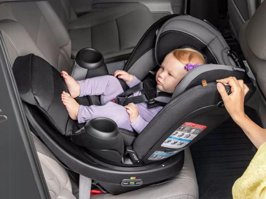 baby in Evenflo Revolve 360 Extend All-in-One Rotational Convertible Car Seat w/ Quick Clean Cover in car