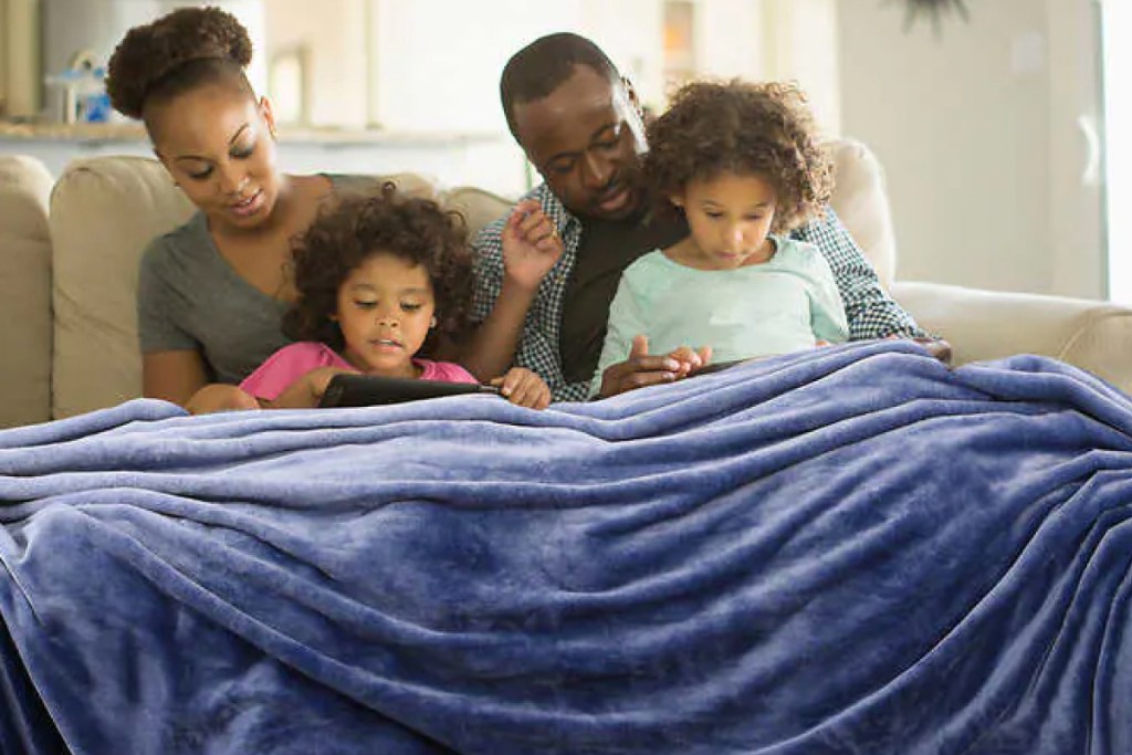 Family in family-sized blanket