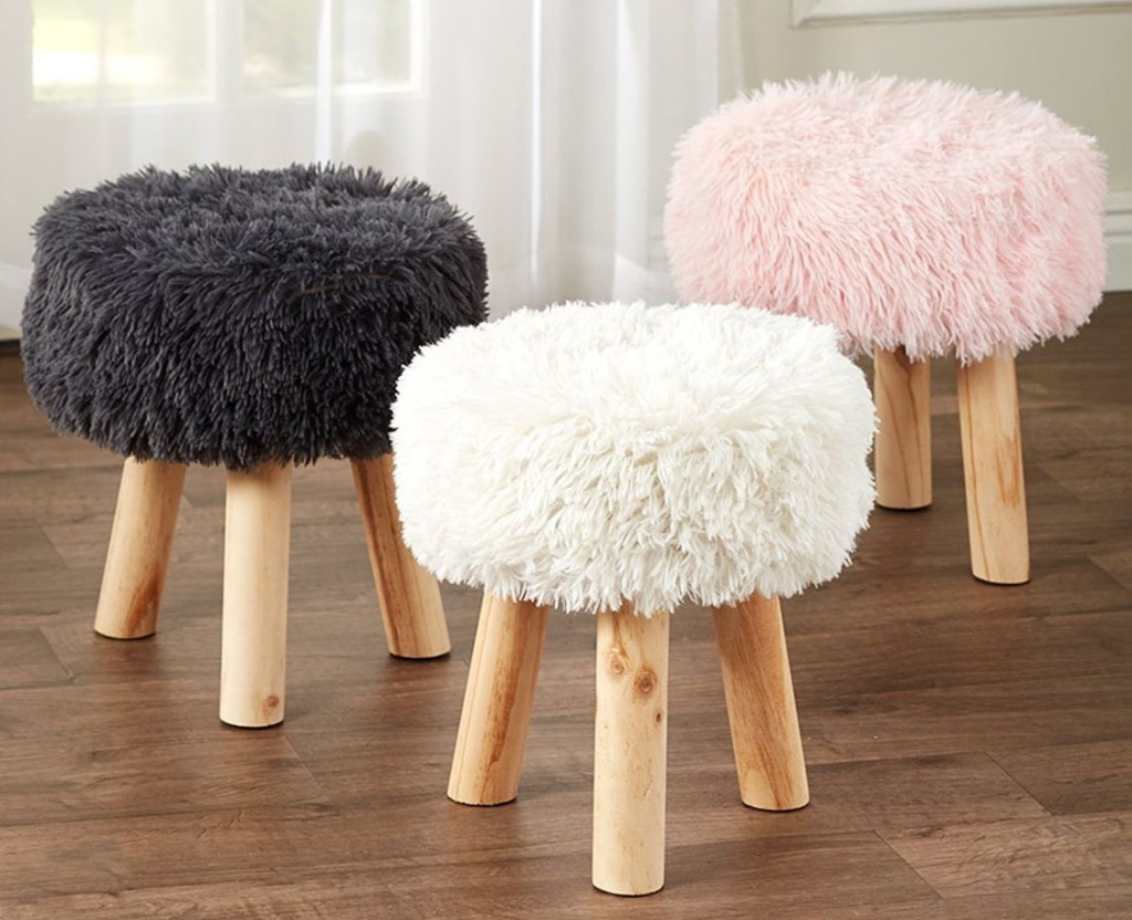 Black, white, and pink faux-fur covered stools