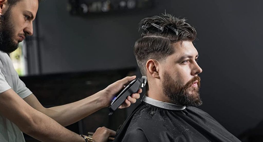 man using glaker hair clippers on guy