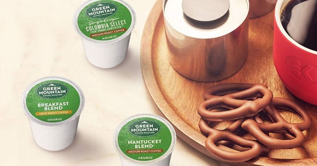 Green Mountain coffee k-cups next to a tray with pretzels and coffee