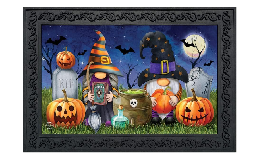 A fall rug featuring gnomes and pumpkins