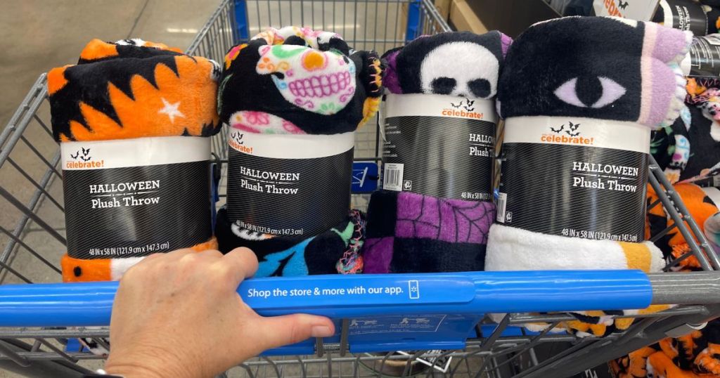 four Halloween throw blankets in Walmart shopping cart