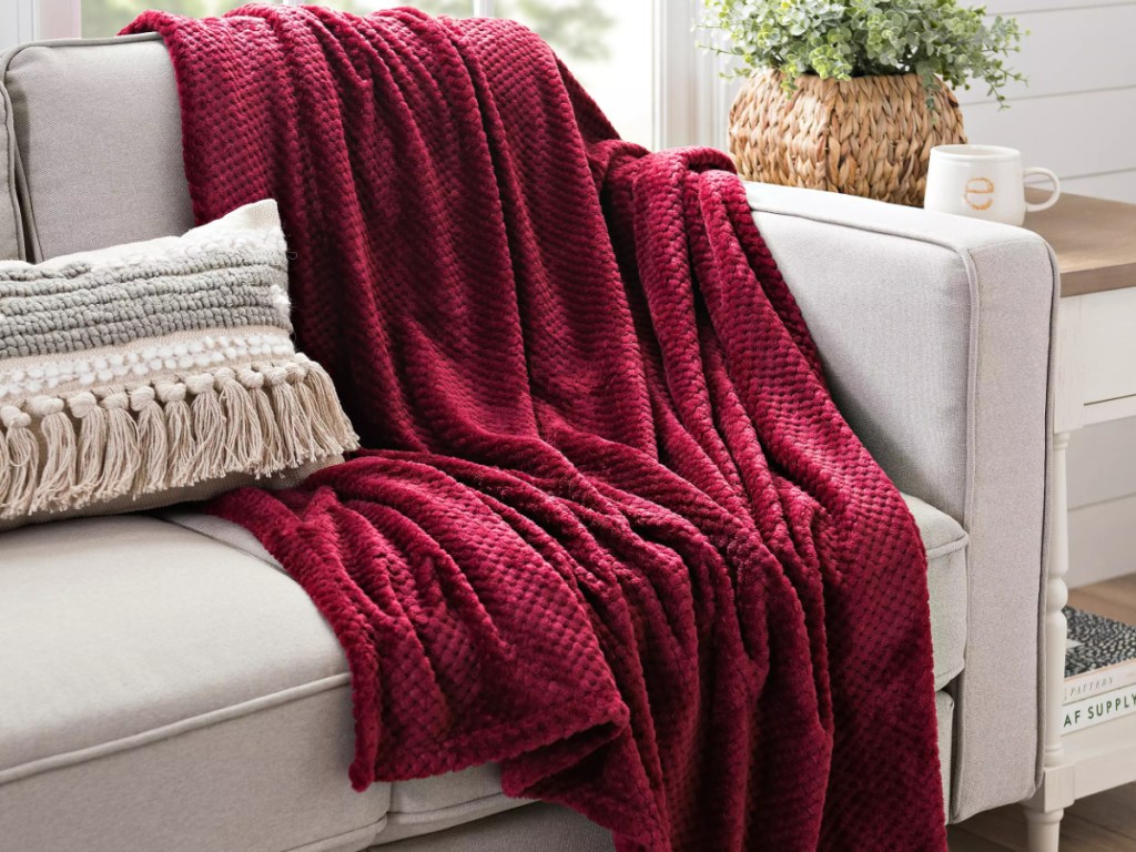 red throw blanket over couch