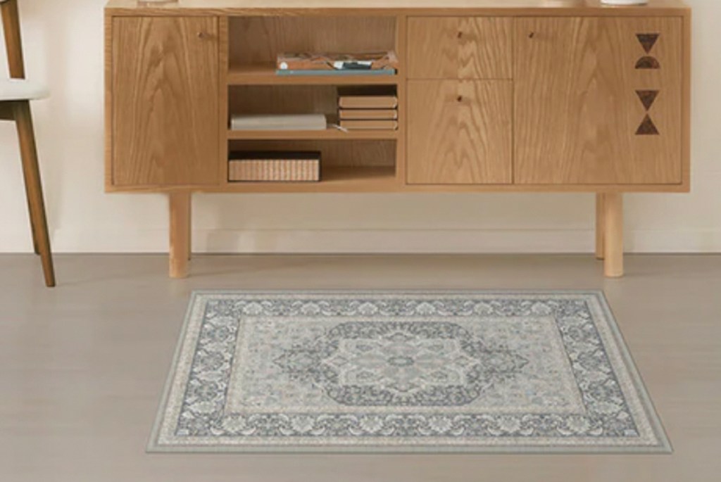 small rug in front of console table