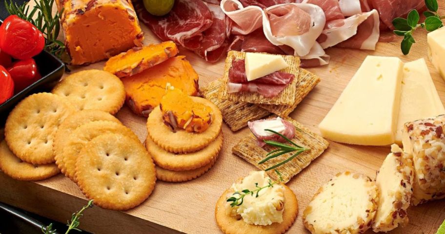 Ritz Crackers shown on a Charcuterie Board with cheeses, meat and fruits