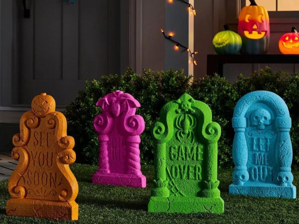4 brightly colored foam tombstone decorations