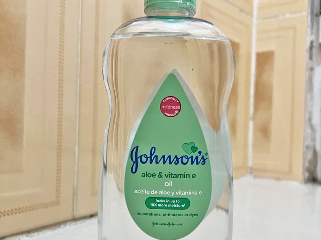 bottle of Johnson's Baby Oil in bathroom