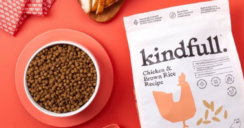 cat food in bowl next to bag