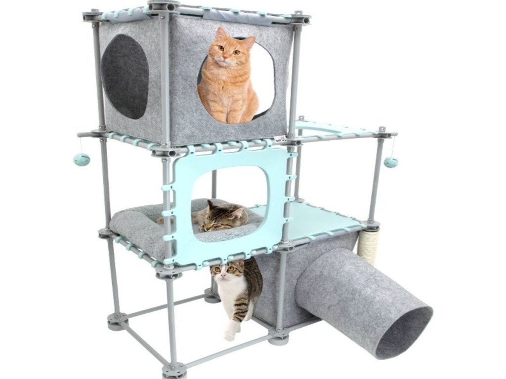 Large three leve cat tower with three cats on it.