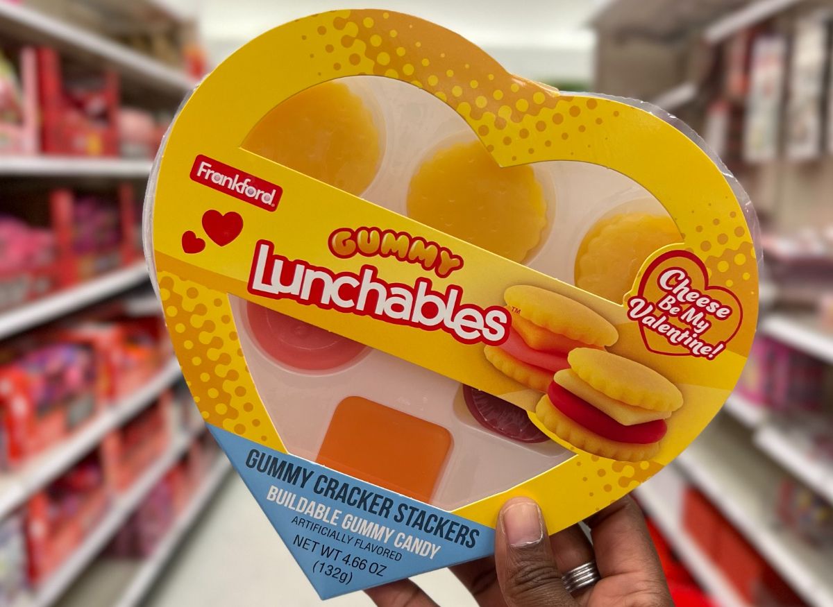 heart shaped box of gummy Lunchables cracker stackers held in hand in a store aisle