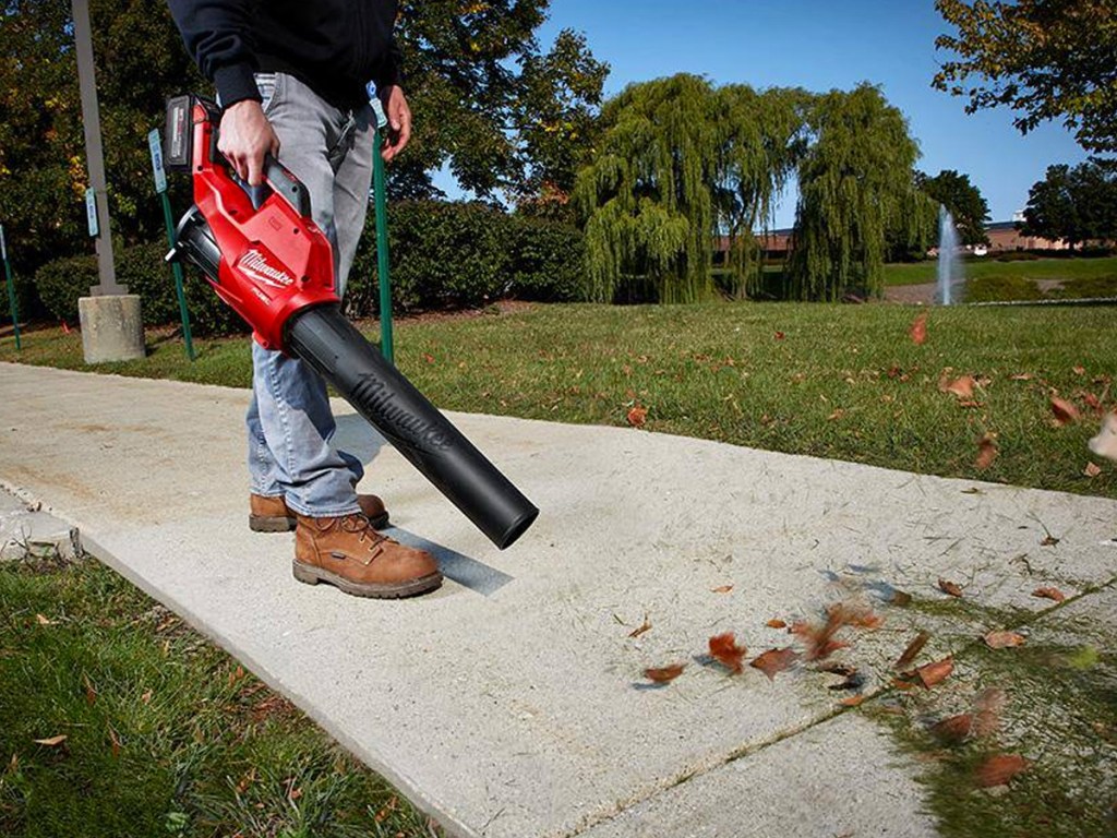 using red leaf blower to clean driveway