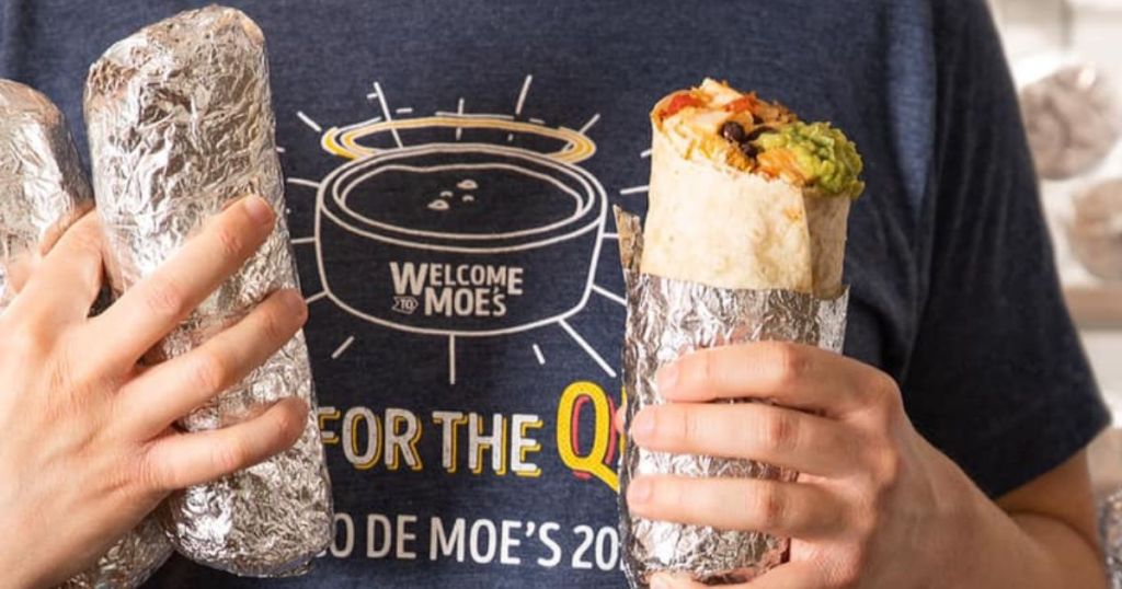 person holding Moe's Burritos