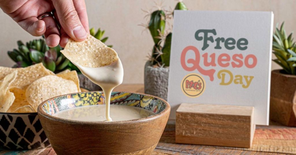Get free food when you sign up for Moe's app like this man who is dipping a chip in Moe's free queso.